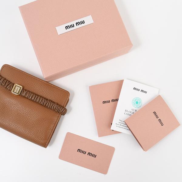 MIU MIU レザーバンド付き 二つ折り財布